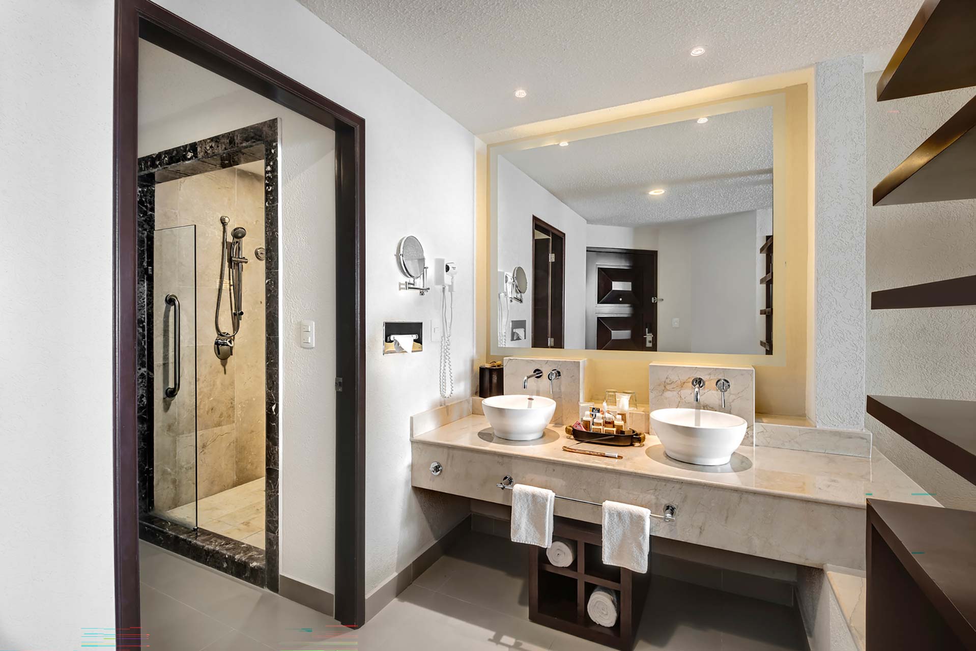 Bathroom with two sinks and a shower