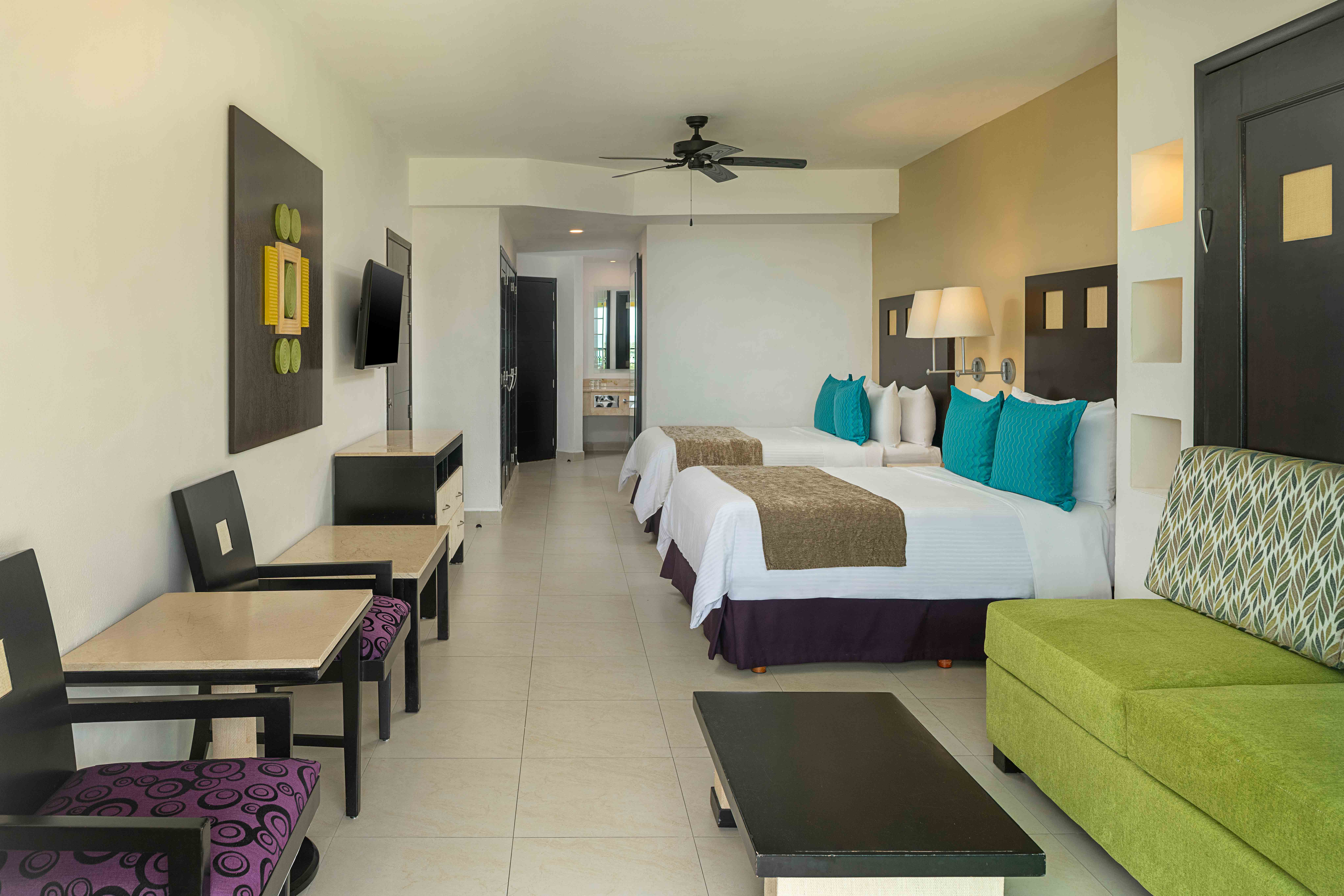 Family room with two beds and seating area