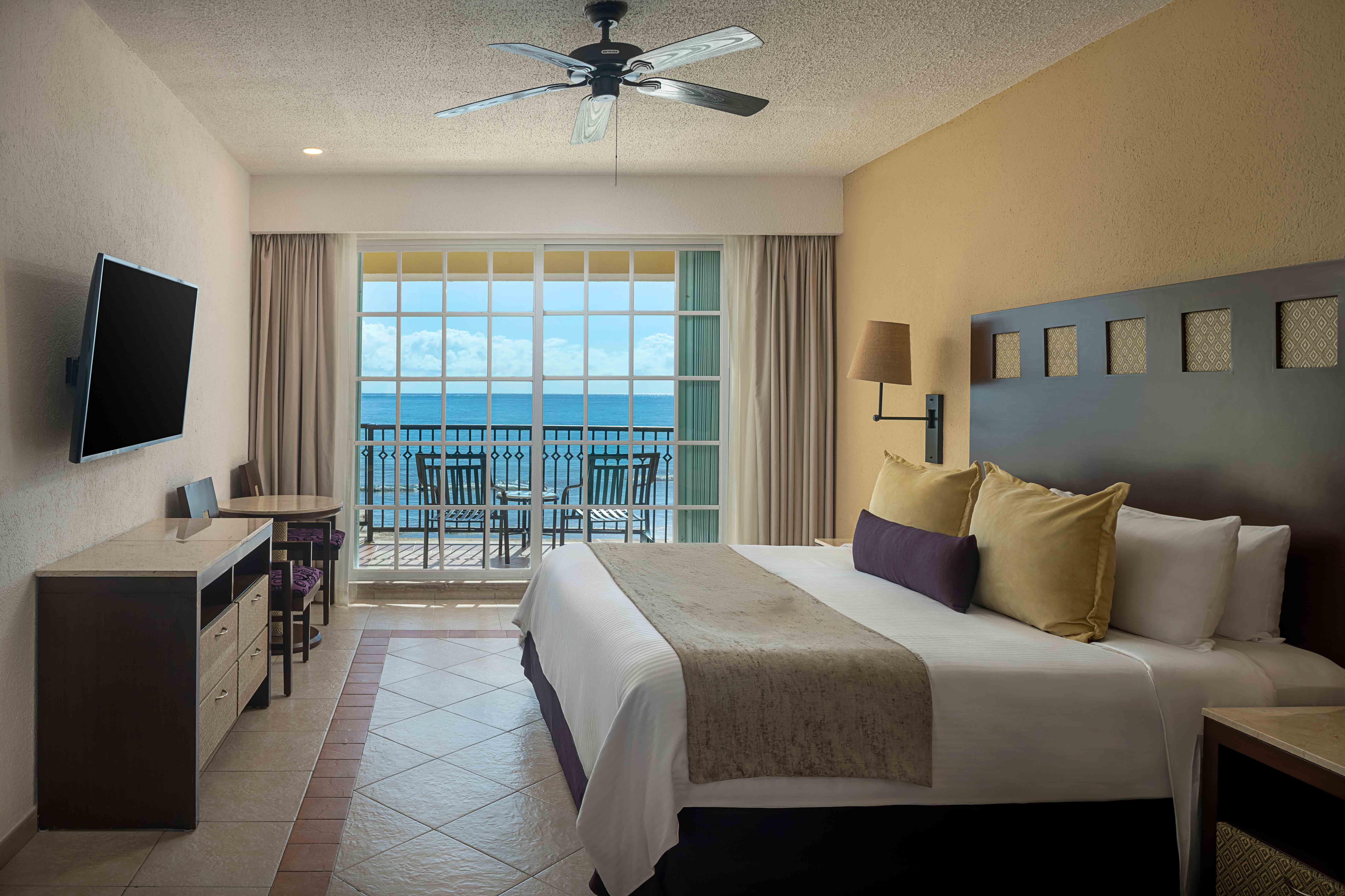 Bedroom with one bed and a flat-screen TV