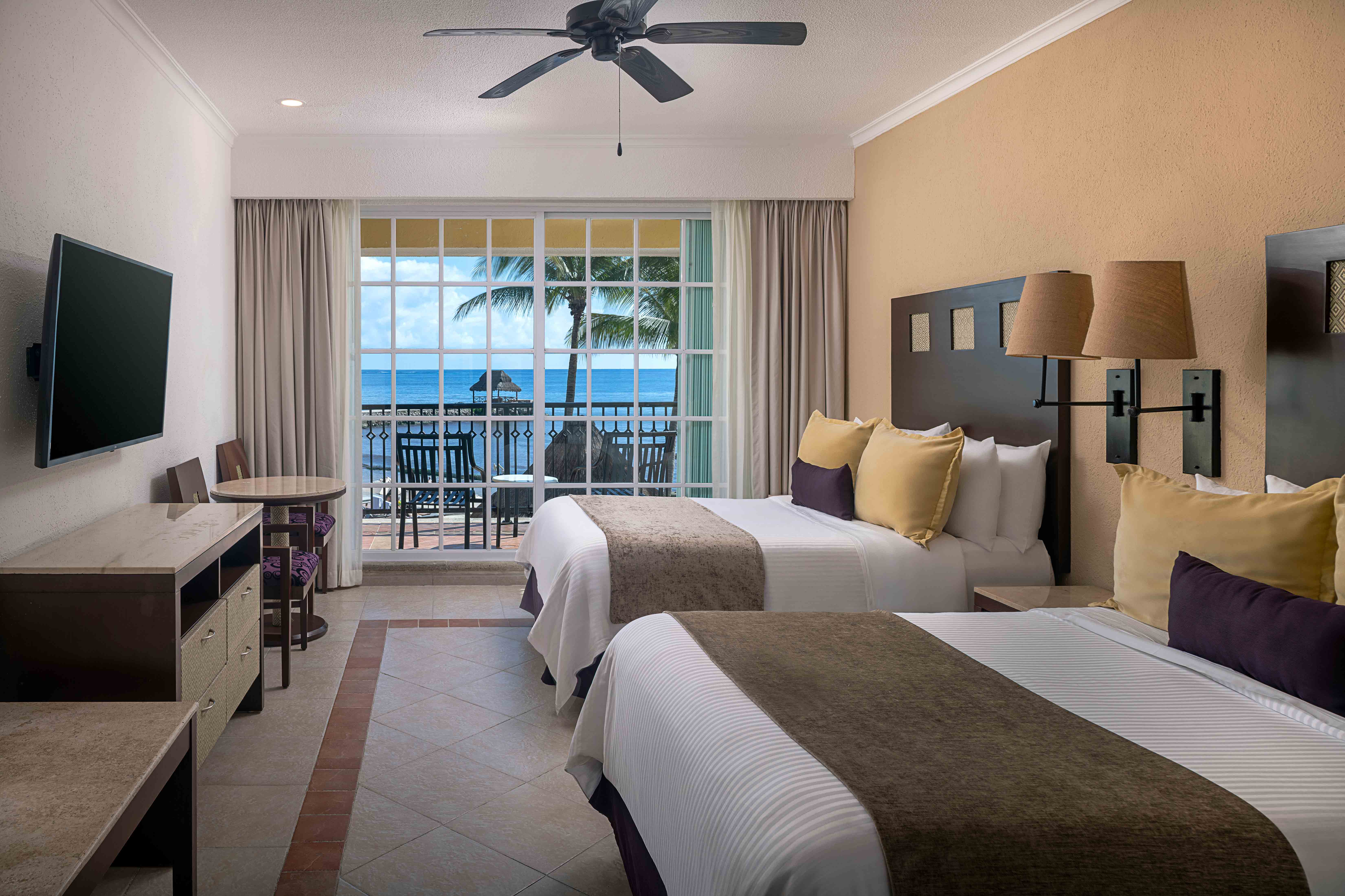 Bedroom with two double bed and a private balcony